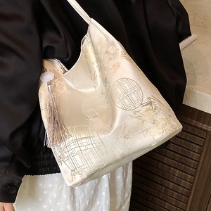 Elegant Chinese style embroidered tote bag with floral patterns and silk tassel