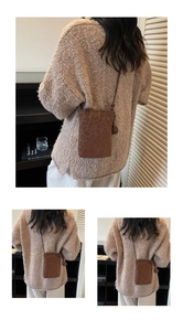 Detailed view of mini leopard print crossbody bag with knotted strap and suede texture