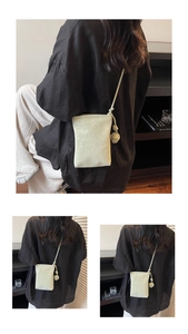 Close-up of cream leopard print crossbody phone bag with knotted strap detail and retro style