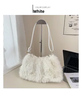 Close-up of white plush bucket bag with long faux fur texture and golden metal hooks