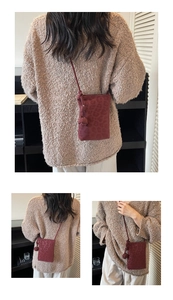 Detail of burgundy leopard print phone bag with stylish woven knot shoulder strap design
