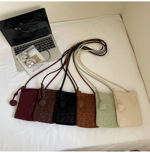 Detail view of mini crossbody leopard bags in six colors with stylish braided rope straps