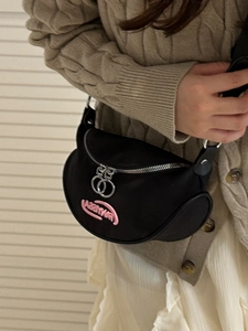 Black crescent nylon crossbody bag with pink embroidery and double ring zippers