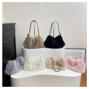 Detailed view of plush faux fur bucket bags in brown, black, grey, white, beige and pink