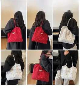 Detailed views of vintage polka dot canvas tote bags in red and white colors