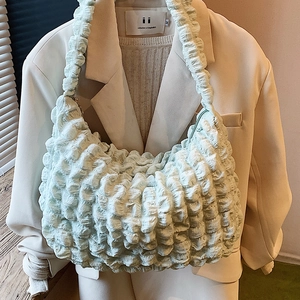 Chic mint green pleated bubble fabric crossbody bag with a trendy crescent shape