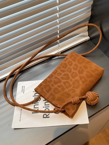 Chic brown leopard embossed suede crossbody bag with elegant knot rope shoulder strap