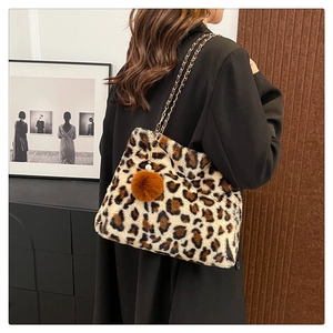 Chic leopard print faux fur tote bag with metal chain strap and decorative pom pom charm