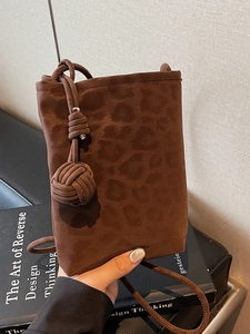 Brown suede crossbody phone bag with leopard embossing and decorative rope knot detail