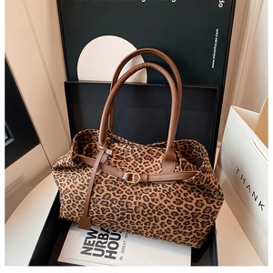 Leopard print tote bag displayed in an elegant gift box with stylish handle details