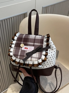 Sweet floral backpack with brown plaid flap, black bow detail, and star pattern print