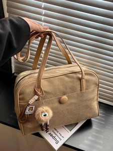 Retro khaki suede shoulder bag with large capacity and plush charm for daily commute