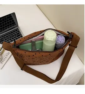 Detail view of large capacity corduroy crossbody bag showing spacious interior space