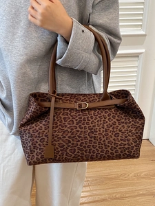 Large leopard print suede tote bag with brown straps and golden buckle detail