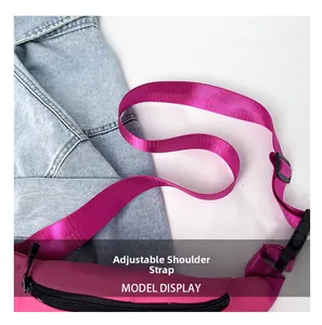 Detailed macro view of the adjustable woven nylon strap on a bright magenta oxford chest bag