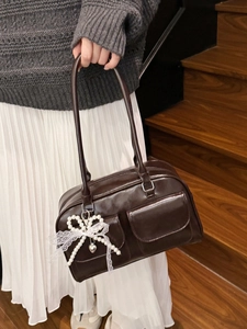 Glossy coffee brown tote bag with twin front pockets and pearl bow charm accessory