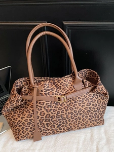 Stylish large leopard print suede tote bag with brown handles and golden buckle detail