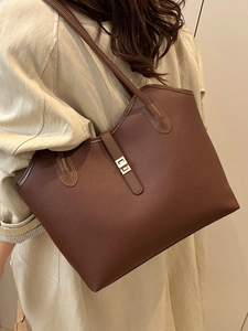 Brown large capacity leather tote bag with gold twist lock and lychee grain texture