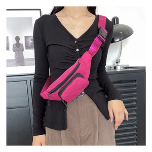 Close-up of rose red waterproof oxford waist bag with adjustable strap on a model