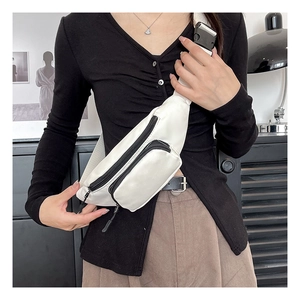 Modern white waterproof oxford chest bag shown on model in a minimalist home setting