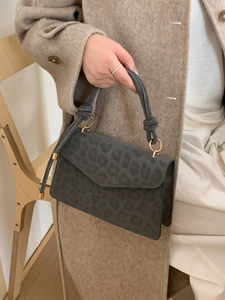 Leopard print crossbody bag with knotted handle and matte suede texture for autumn