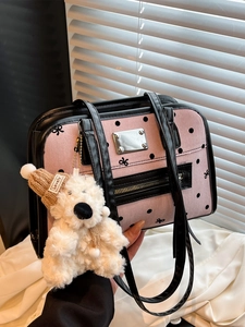 Pink polka dot vintage tote bag with black leather trim and cute plush bear charm