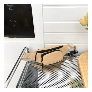 Detail view of khaki waterproof oxford fabric waist bag with durable dual metal zippers