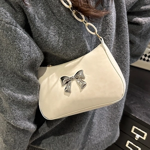 Creamy white baguette shoulder bag with silver butterfly buckle and chunky chain strap