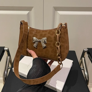 Dark brown leopard print shoulder bag with silver butterfly buckle and link chain