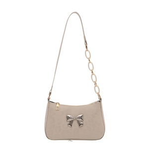 Minimalist beige shoulder bag featuring silver metal bow and acrylic chain strap detail