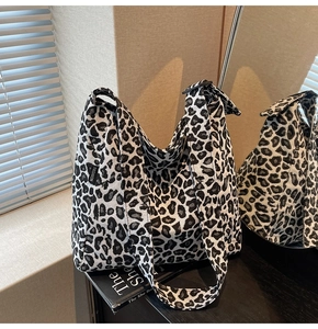 Detailed view of large leopard print tote bag with black and white canvas fabric texture