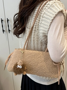 Khaki faux shearling shoulder bag for women with a cute plush monster charm detail