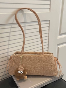 Brown fleece shoulder bag with leather straps and cute monster plush pendant charm