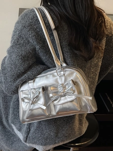 Silver metallic Y2K shoulder bag with bow pockets and sleek polished finish