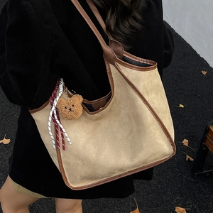 Retro khaki corduroy hobo shoulder bag with brown leather trim and bear pendant