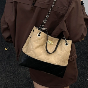 Quilted tote bag in beige suede and black base with metal chain strap and gold clasp