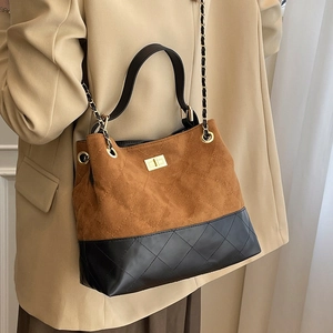 Retro contrast bucket bag with quilted suede and leather featuring a gold turn-lock