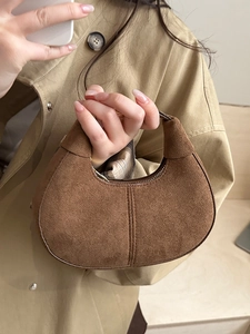 Brown suede minimalist half-moon hobo bag with top handle and vintage matte texture
