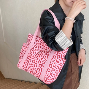 Pink leopard print tote bag for women featuring a spacious design and durable nylon straps