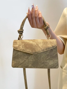 Chic vintage gradient crossbody bag with unique knot top handle and gold ring detail