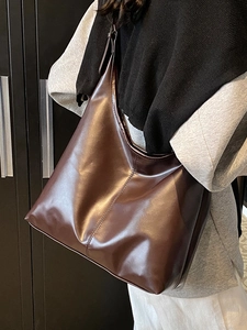 Deep brown oversized tote bag in glossy synthetic leather for fashion daily commuting