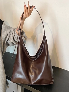 2025 stylish dark brown leather tote bag with adjustable strap for daily commuting