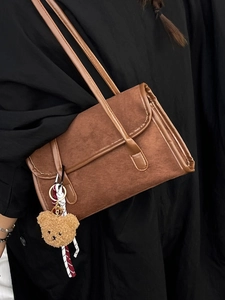 Brown matte underarm bag for women with flap closure and cute teddy bear pendant charm