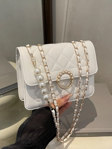 White quilted flap bag with gold pearl chain and pearl-studded metal buckle detail