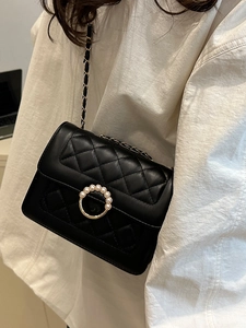 Elegant black quilted chain bag with pearl buckle and golden shoulder strap for women
