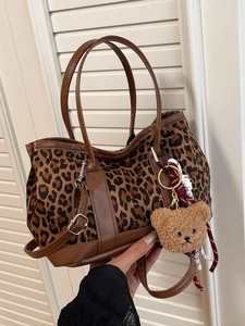 Retro leopard print tote bag with brown faux leather trim and cute plush bear charm