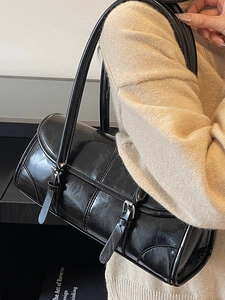 2025 trendy black glossy leather underarm bag with silver buckle and sleek shoulder straps
