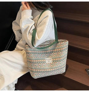 Ethnic geometric pattern canvas tote bag showcased in a casual outdoor lifestyle setting