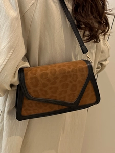 Brown leopard print crossbody bag with envelope flap and adjustable black strap for women