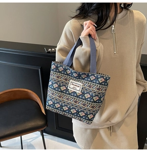Ethnic geometric pattern tote bag shown over the shoulder for daily commuting use